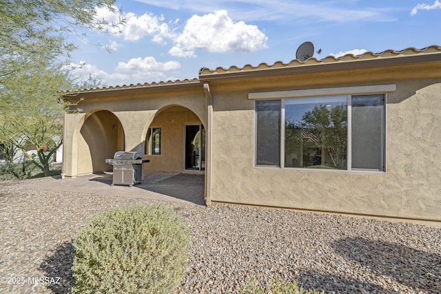 rear view of house with a patio