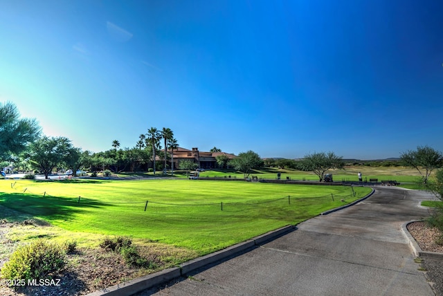 view of property's community with a lawn