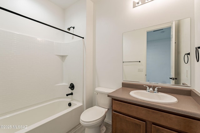 full bathroom featuring bathtub / shower combination, vanity, and toilet