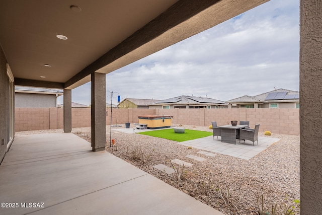 view of patio with a hot tub