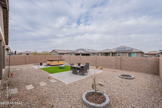 view of yard with a patio and a hot tub