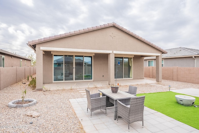 back of house with a patio