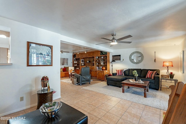 living room with ceiling fan, light tile patterned floors, and rail lighting