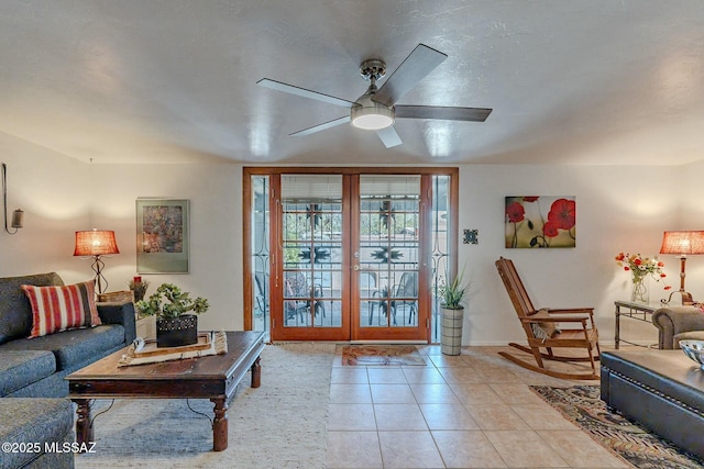 living room featuring ceiling fan and light tile patterned flooring