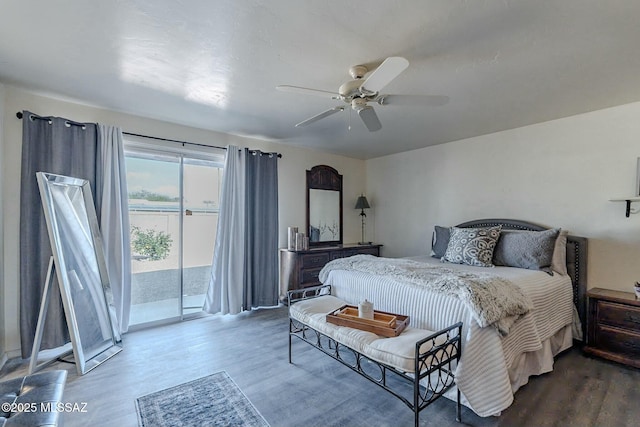 bedroom featuring hardwood / wood-style floors, ceiling fan, and access to outside