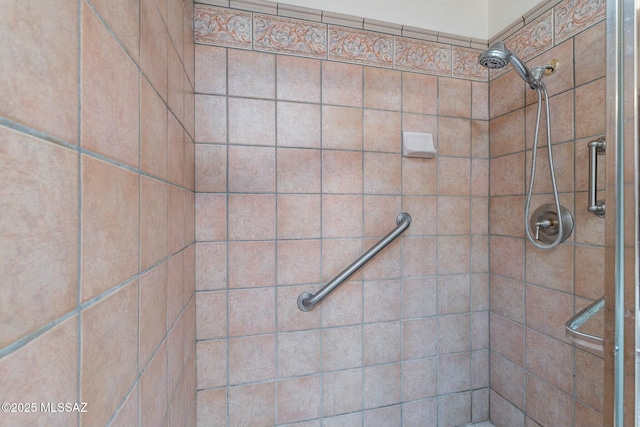 bathroom with tiled shower