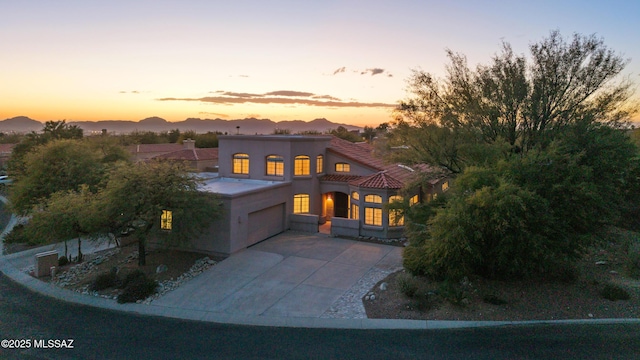 view of front of house featuring a mountain view and a garage