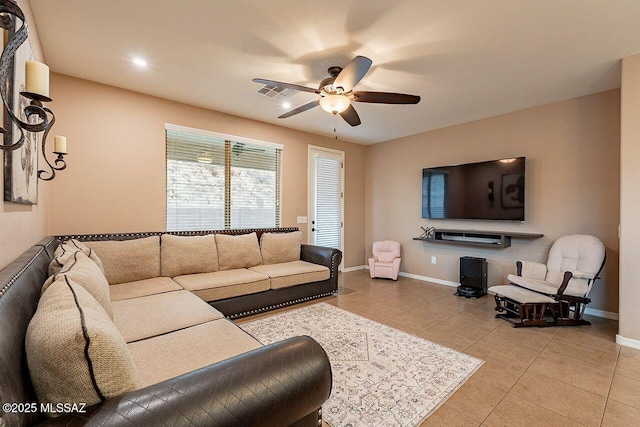 tiled living room featuring ceiling fan