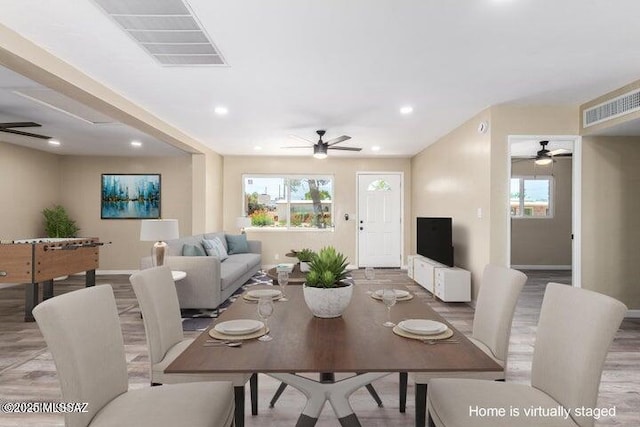 dining room with ceiling fan and wood-type flooring