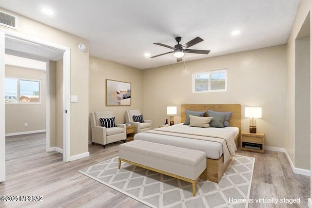 bedroom featuring ceiling fan and light wood-type flooring