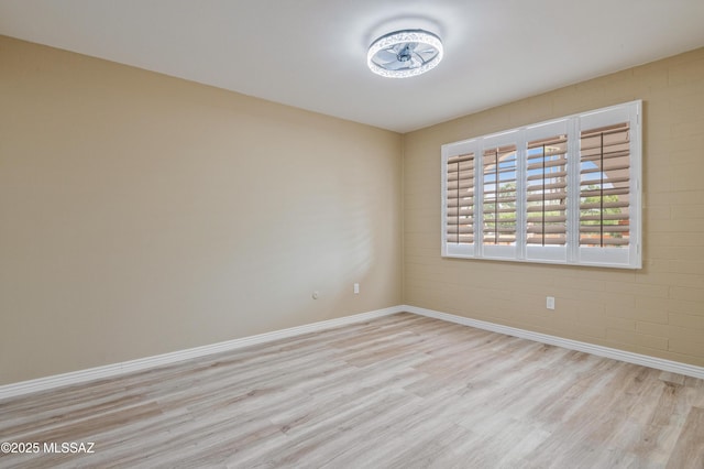 176 S Paseo Pena Unit C, Green Valley, AZ 85614 - unfurnished room with baseboards and wood finished floors