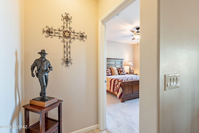 carpeted bedroom featuring ceiling fan