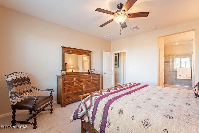 bedroom with ceiling fan, light carpet, and connected bathroom