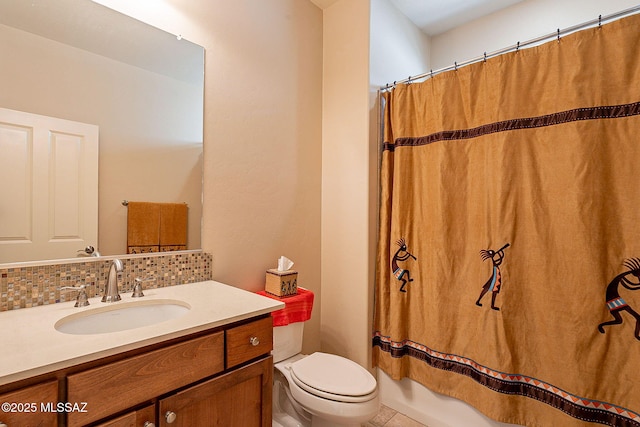 bathroom featuring decorative backsplash, vanity, and toilet