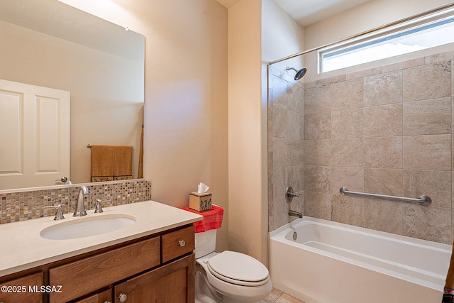 full bathroom featuring tiled shower / bath combo, toilet, backsplash, and vanity