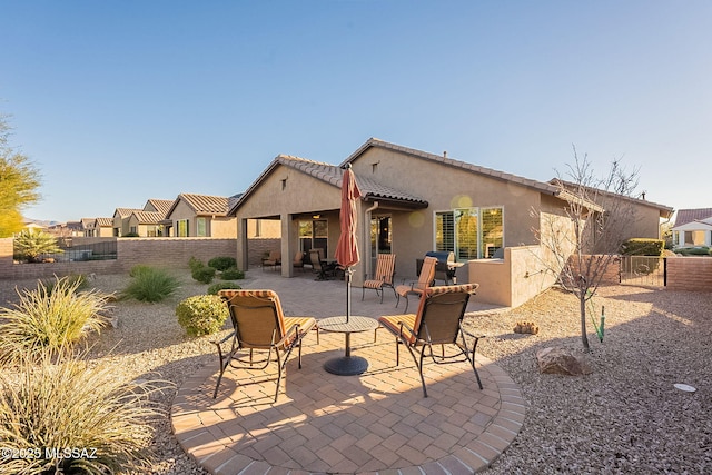 rear view of house featuring a patio