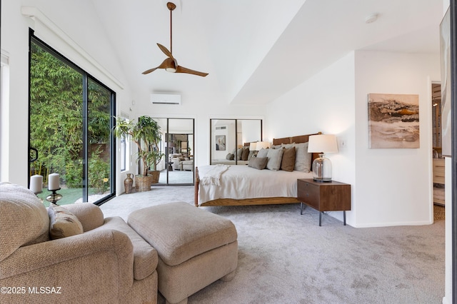 bedroom with ceiling fan, access to outside, a wall unit AC, and multiple windows