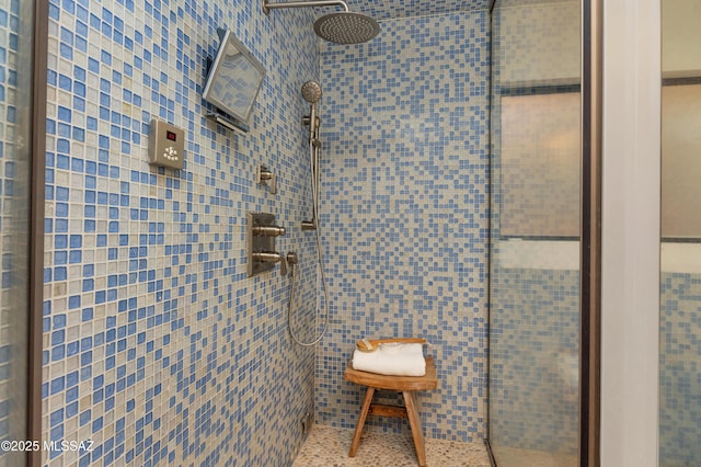 bathroom with tiled shower