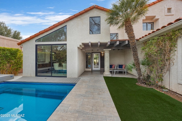 back of house featuring a patio