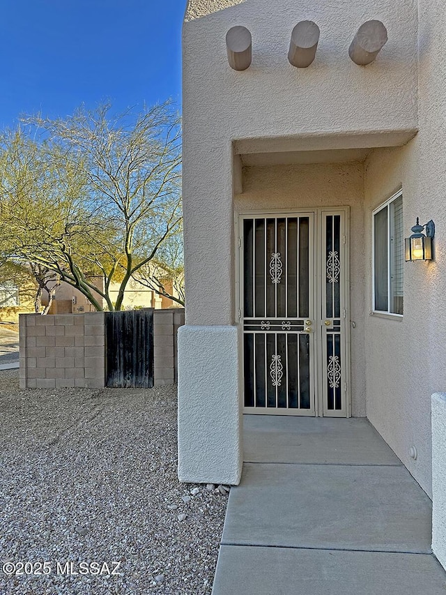 entrance to property with a patio area