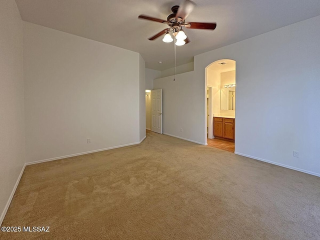 interior space with light colored carpet and ceiling fan