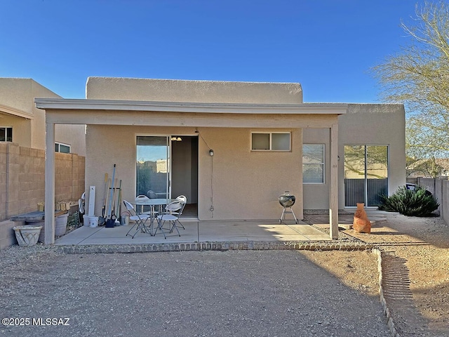 rear view of property featuring a patio