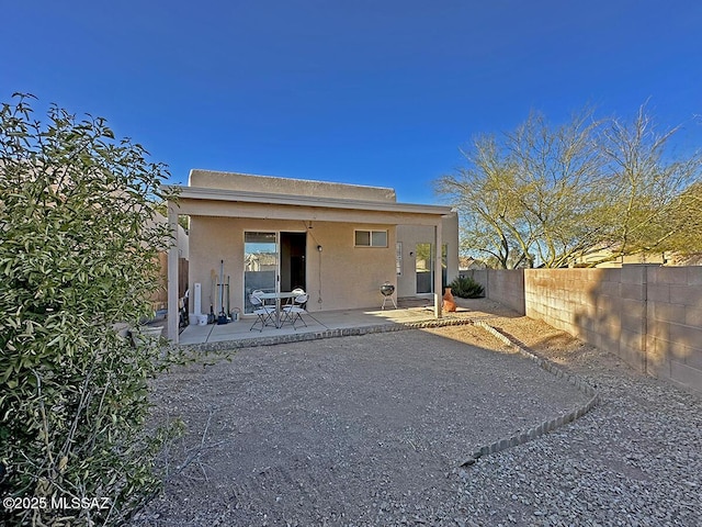 rear view of house with a patio