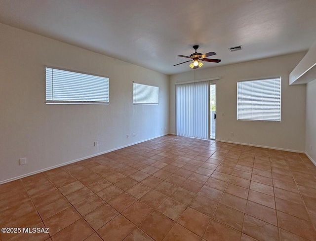 unfurnished room featuring ceiling fan and light tile patterned floors