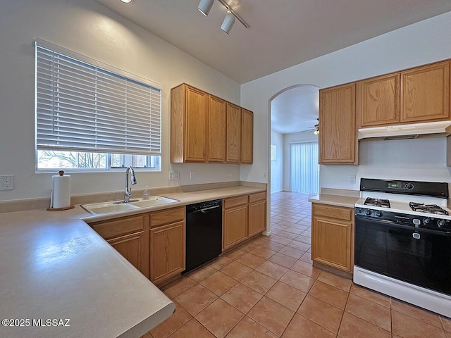 kitchen with range with gas stovetop, black dishwasher, sink, light tile patterned floors, and ceiling fan