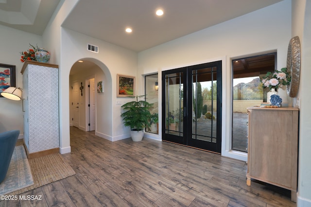 entrance foyer featuring french doors and wood-type flooring