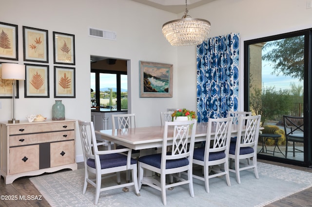 dining space featuring a chandelier and hardwood / wood-style floors