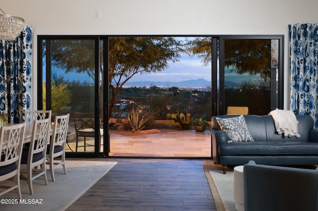 interior space featuring a mountain view and a chandelier