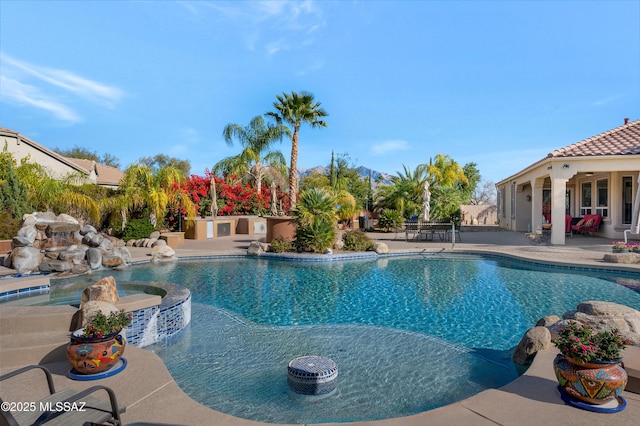 view of swimming pool with a patio area