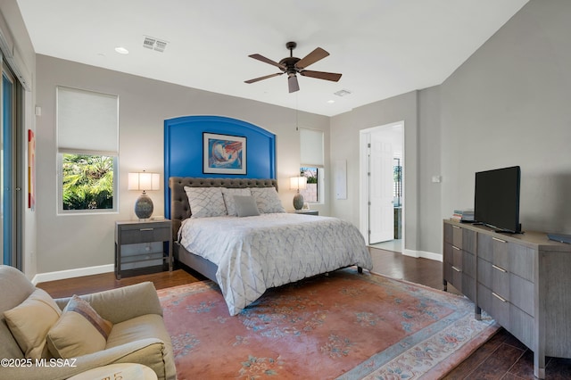 bedroom with ceiling fan and dark hardwood / wood-style flooring