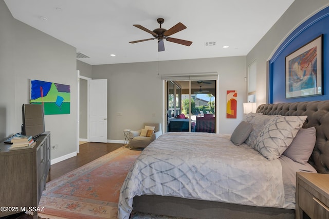 bedroom featuring access to exterior, ceiling fan, and dark wood-type flooring