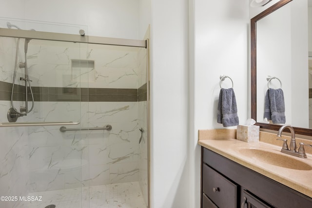 bathroom featuring vanity and an enclosed shower