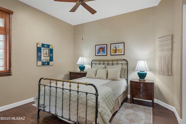 bedroom with dark hardwood / wood-style floors and ceiling fan