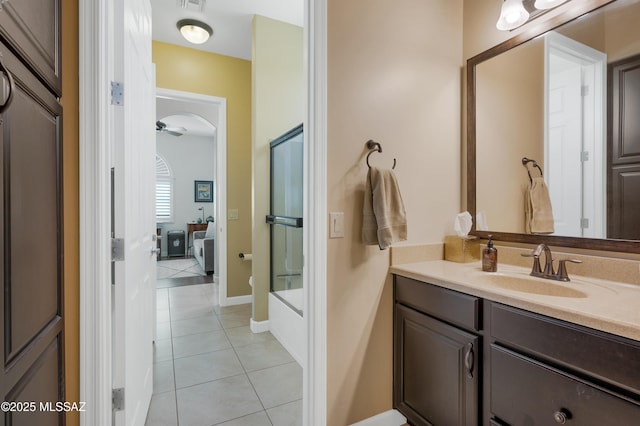 bathroom featuring vanity, tile patterned floors, ceiling fan, and bath / shower combo with glass door