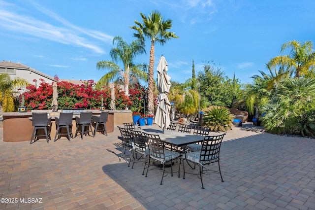 view of patio with an outdoor bar