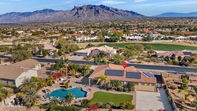 birds eye view of property featuring a mountain view