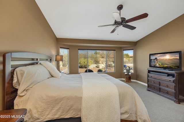 carpeted bedroom with ceiling fan and lofted ceiling