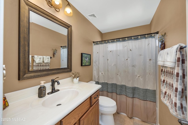 bathroom featuring toilet, vanity, a shower with curtain, and tile patterned flooring