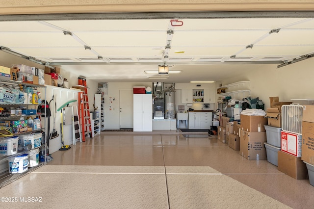 garage featuring a garage door opener and gas water heater