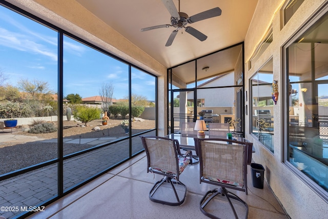 sunroom / solarium with ceiling fan