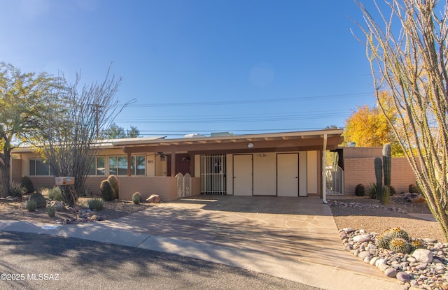 single story home featuring a carport