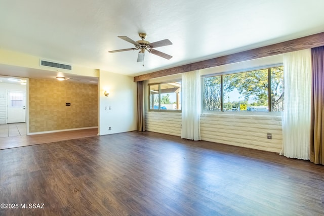 unfurnished room featuring dark hardwood / wood-style floors and ceiling fan