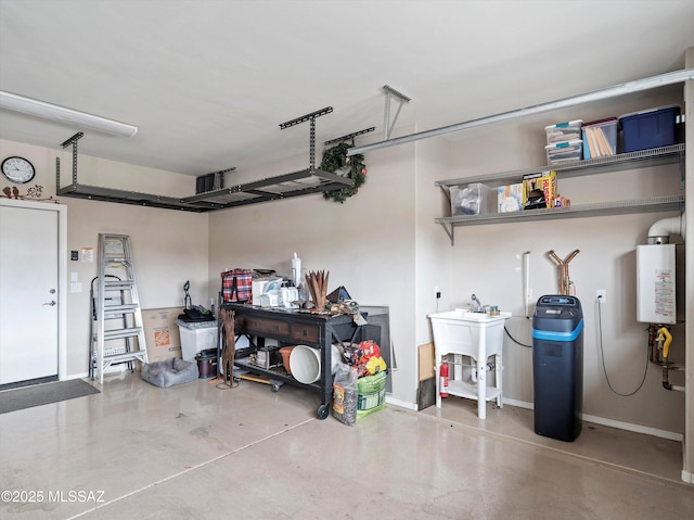 garage with water heater and sink