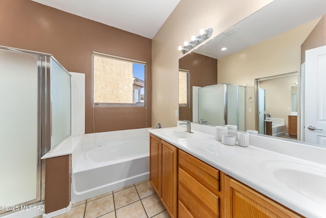 full bath with a bath, a shower stall, a sink, and tile patterned floors