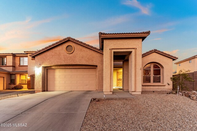 view of front of house with a mountain view and a garage