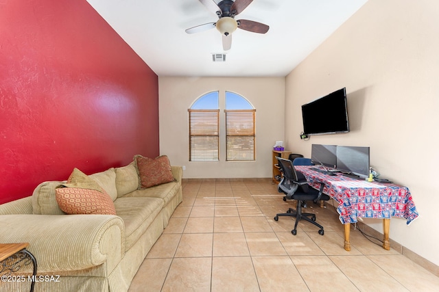 tiled office space with baseboards, visible vents, and a ceiling fan